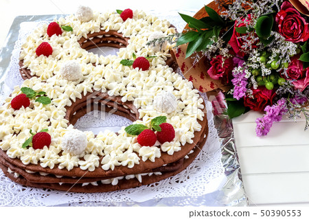Big number cake shape of 8 decorated white Big number cake shape of 8 decorated white 50390553