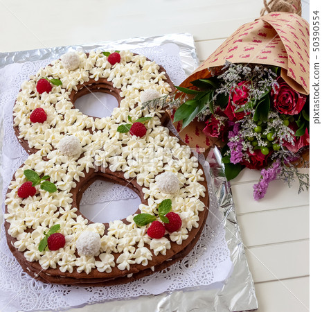 Big number cake shape of 8 decorated white Big number cake shape of 8 decorated white 50390554