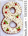Big number cake shape of 8 decorated white 50390555