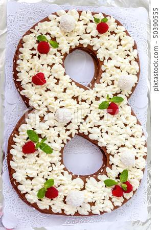 Big number cake shape of 8 decorated white Big number cake shape of 8 decorated white 50390555