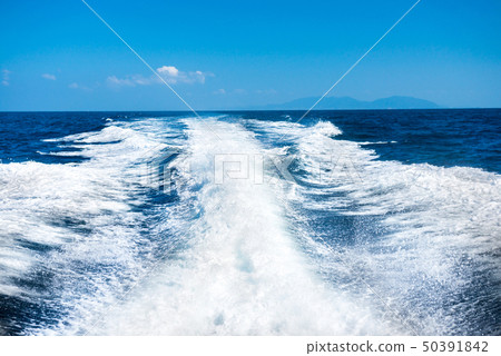 Wake of boat on water surface Wake of boat on water surface 50391842