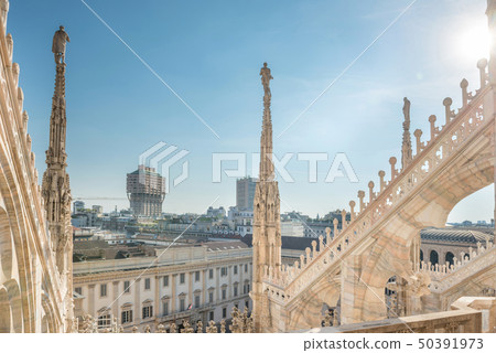 View from roof of Duomo to spires with statues and View from roof of Duomo to spires with statues and 50391973