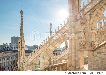 Statues and decoration on roof of Duomo in Milan Statues and decoration on roof of Duomo in Milan 50391974