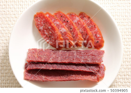 Assorted snacks. Dry sausage and beef jerky. Assorted snacks. Dry sausage and beef jerky. 50394905