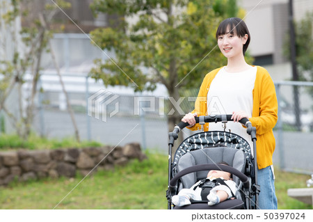 Mother and baby going out with baby stroller Walk Parenting Parenting 50397024