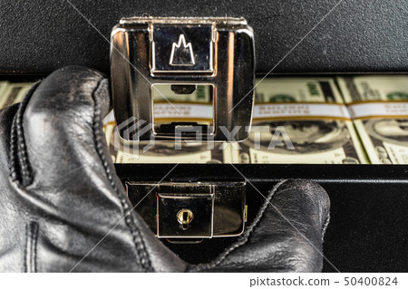 Black case full of dollar bills close up.Money 50400824