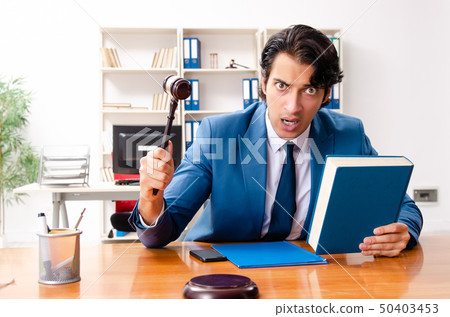 Young handsome judge sitting in courtroom   50403453