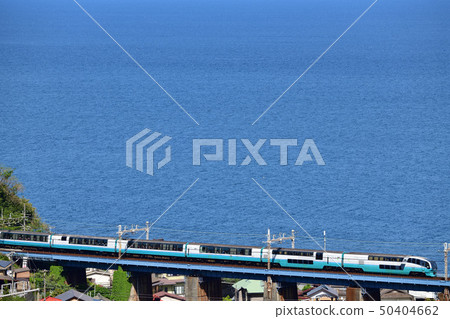 Tokaido Line Limited Express Super View Odoriko crossing an iron bridge overlooking the sea Tokaido Line Limited Express Super View Odoriko crossing an iron bridge overlooking the sea 50404662