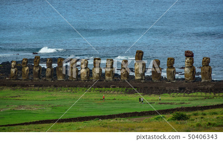 Moai statues on Easter Island with tourists from the distance. Ahu Tongariki 50406343