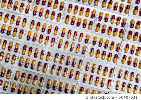 Pharmaceutical industry. Red-yellow capsule pills 50407631