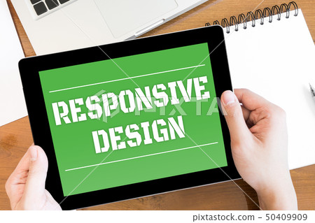 Hands are holding a tablet with RESPONSIVE DESIGN 50409909