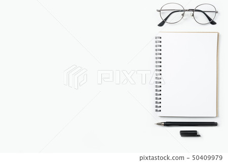 Minimal desk with notebook, pen and eye glasses Minimal desk with notebook, pen and eye glasses 50409979
