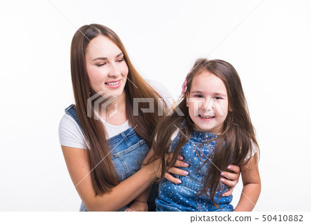 Parenting, family and children concept - Portrait of a mother and her baby girl have fun and smiling 50410882