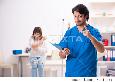Young male foctor and female patient in blood transfusion concep Young male foctor and female patient in blood transfusion concep 50410953