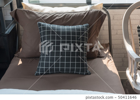 black and white pillows set on single bed 50411646