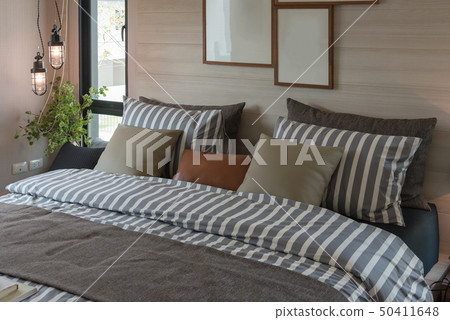 modern bedroom with set of pillows 50411648
