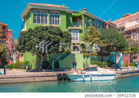 Bright sunny day and colorful holiday apartments.  50412316