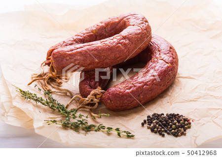 Food, meat and delicious concept - sausages made with horse meat on the table Food, meat and delicious concept - sausages made with horse meat on the table 50412968