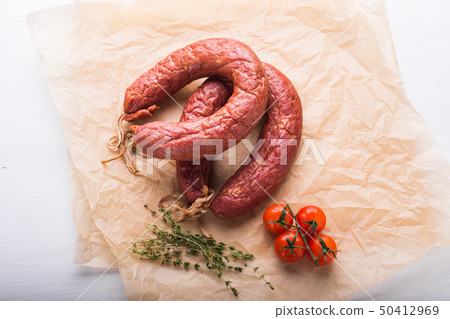 Food, national cuisine and delicious concept - sausages made with horse meat Food, national cuisine and delicious concept - sausages made with horse meat 50412969