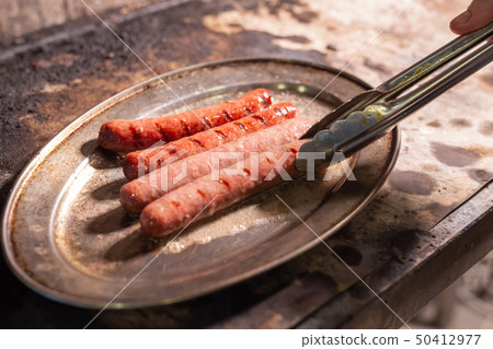 Close up of roasted horse meat sausages 50412977
