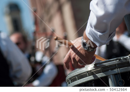 closeup of hand of drummer in scottish band 50412984