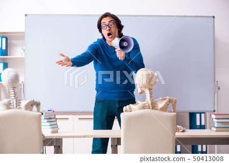 Male teacher and skeleton student in the classroom  50413008
