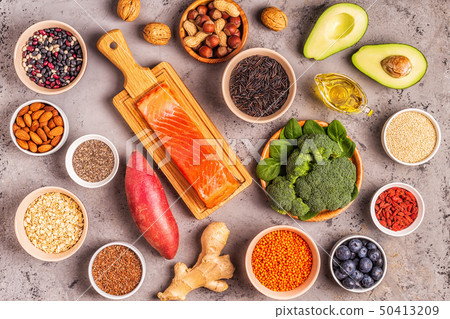 Superfoods on gray concrete background. Top view. Superfoods on gray concrete background. Top view. 50413209