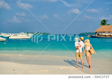 Family with three year old boy on beach Family with three year old boy on beach 50413737