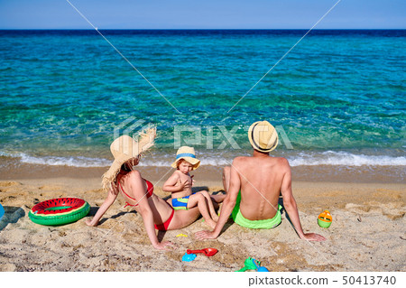 Family on beach in Greece 50413740