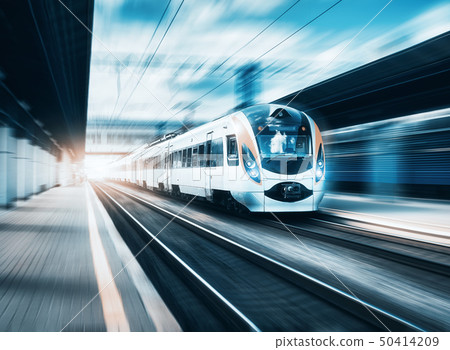 High speed train at the railway station at sunset 50414209