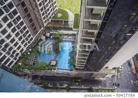 View from the skyscraper at rain and pool 50417789