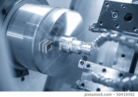 The CNC lathe machine cutting the thread . 50419392