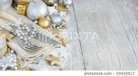 Silver and golden Christmas Table Setting 50420817