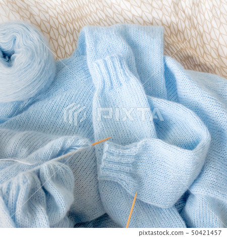 Cardigan from blue wool with the process of mating Cardigan from blue wool with the process of mating 50421457