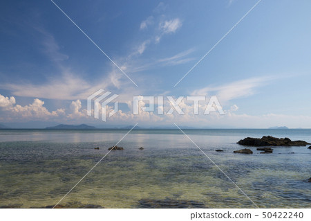 tropical sea and beach with blue sky background 50422240