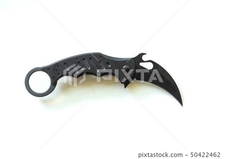 Claw-shaped knife. Animal claw on white backgroun. Claw-shaped knife. Animal claw on white backgroun. 50422462