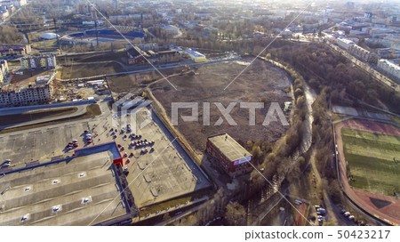 Aerial view of city wasteland and hypermarket  50423217