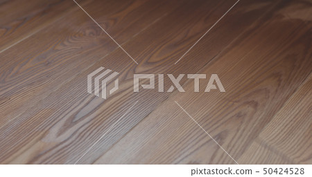 Closeup freshly applied protective oil finish to ash floor Closeup freshly applied protective oil finish to ash floor 50424528