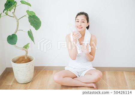 A woman drinking water 50426114