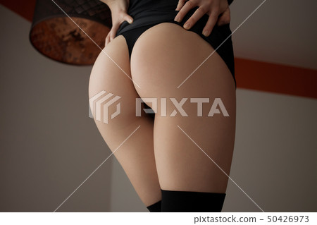 Ass of sensual woman in lingerie in room Ass of sensual woman in lingerie in room 50426973