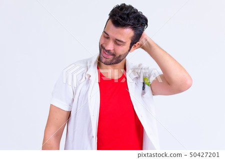 Portrait of happy bearded Persian man thinking and looking down Portrait of happy bearded Persian man thinking and looking down 50427201