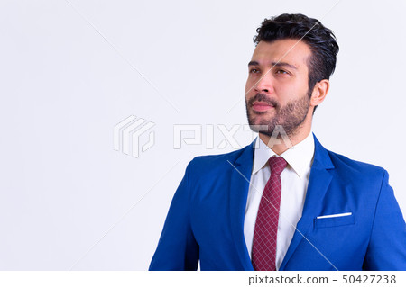 Portrait of handsome bearded Persian businessman thinking Portrait of handsome bearded Persian businessman thinking 50427238