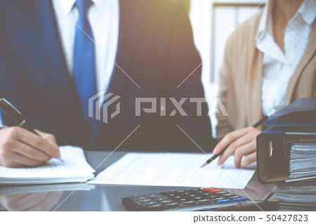 Bookkeeper or financial inspector and secretary making report, calculating or checking balance Bookkeeper or financial inspector and secretary making report, calculating or checking balance 50427823