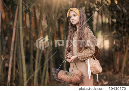 A Caicasian girl with coconut processing in the Mekong Delta Ben Tre, Vietnam. A Caicasian girl with coconut processing in the Mekong Delta Ben Tre, Vietnam. 50430570