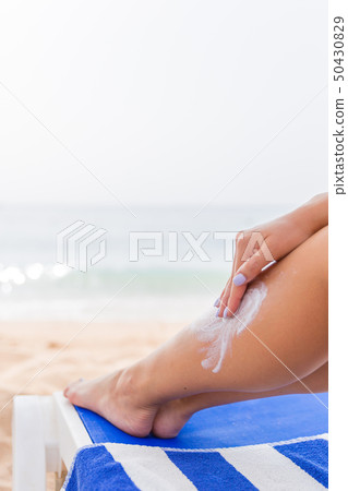 Beautiful lady is sunbathing on the beach Beautiful lady is sunbathing on the beach 50430829