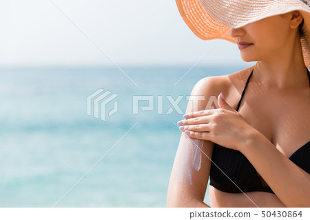 Beautiful lady is sunbathing on the beach Beautiful lady is sunbathing on the beach 50430864