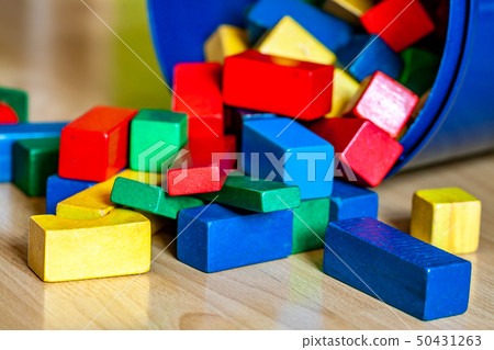 Colorful wooden building blocks on floor . Selective focus Colorful wooden building blocks on floor . Selective focus 50431263