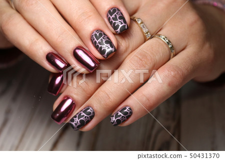 Beautiful woman's nails with beautiful christmas manicure Beautiful woman's nails with beautiful christmas manicure 50431370