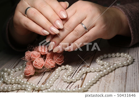 Beautiful woman's nails with beautiful christmas manicure 50431646