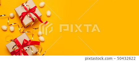 Easter golden decorated eggs with a presents or 50432622